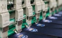 Embroidery machines adding school logos